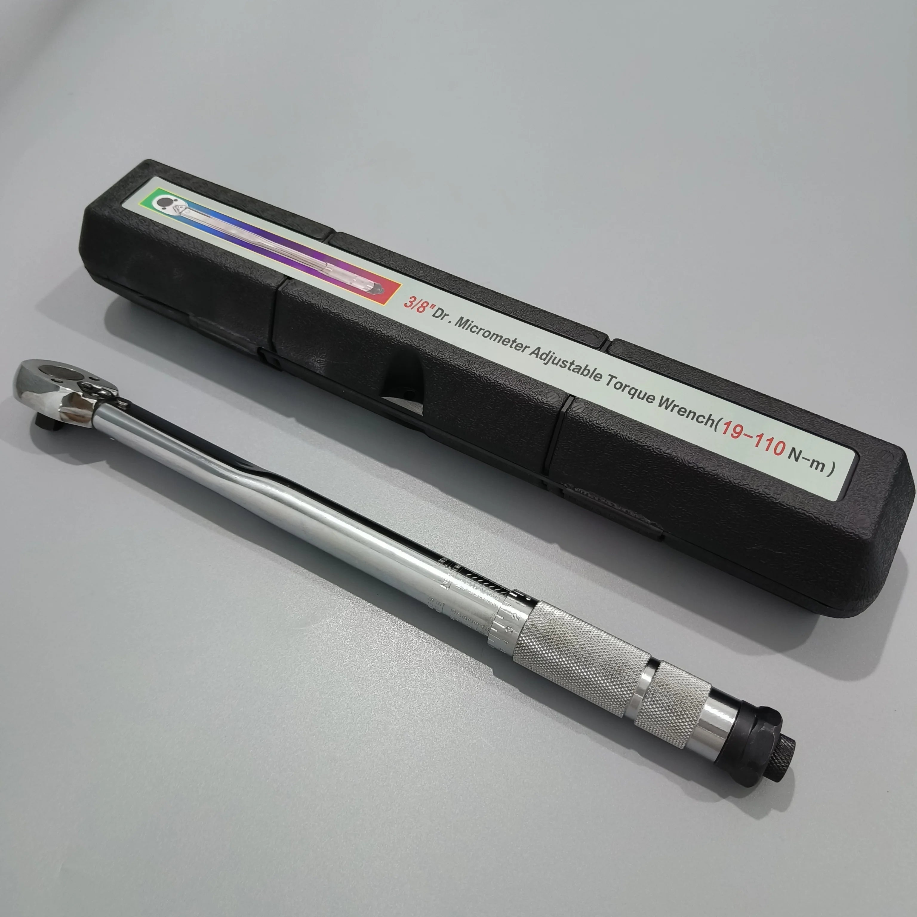 Adjustable Drive Torque Wrench 1/4" 3/8" 1/2" - Chrome finish wrench beside open carry case on grey surface | Wrench Haus