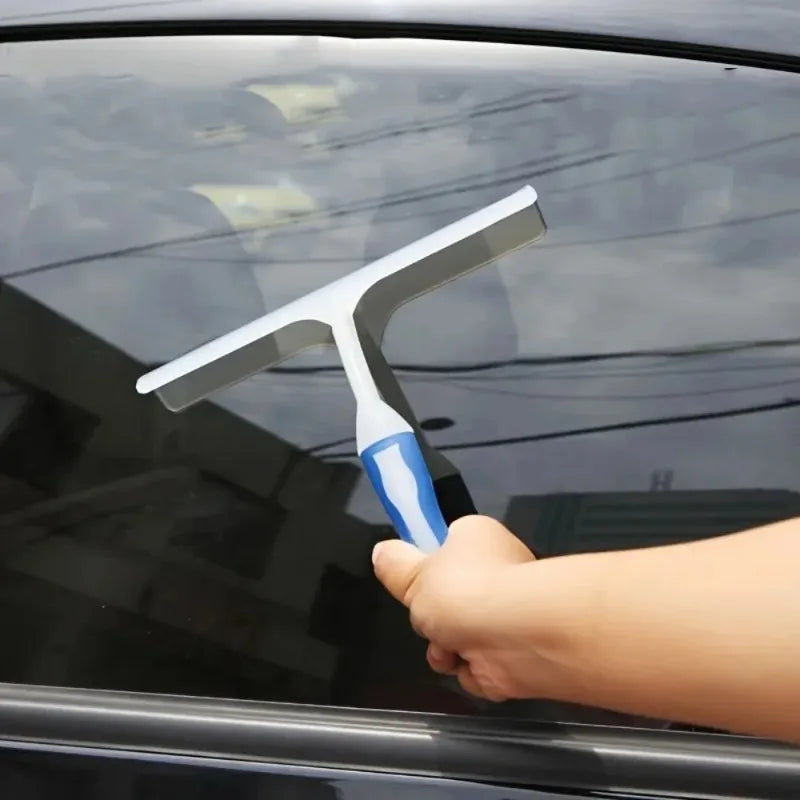 Snow scraper clearing ice off a windshield
