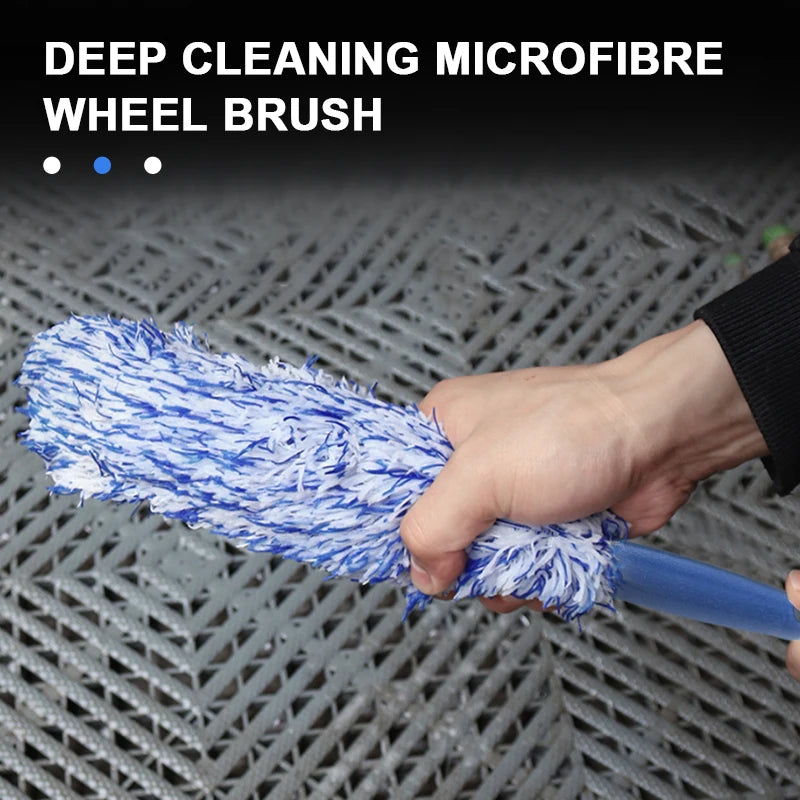 Wheel hub brush cleaning a car wheel
