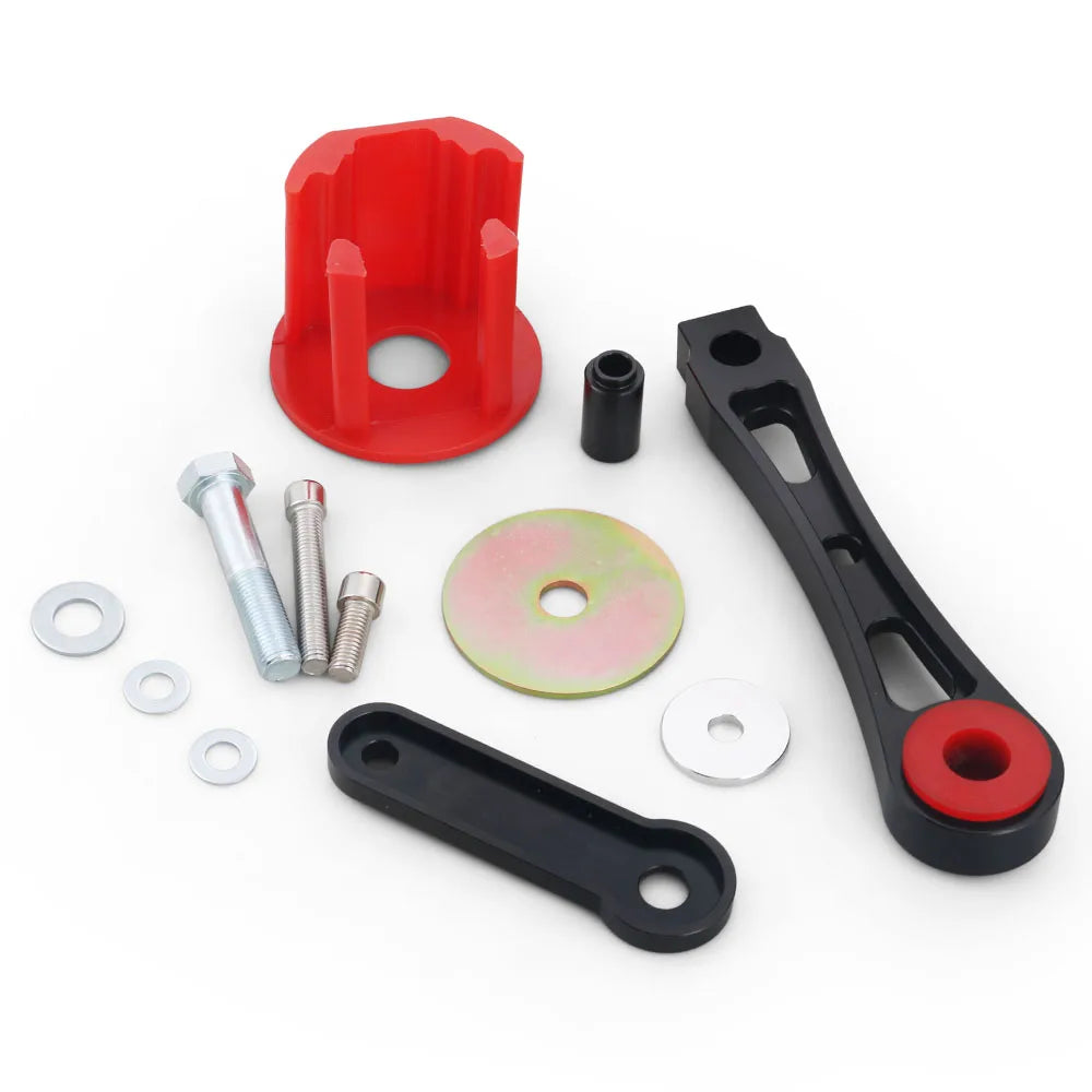 Dogbone engine mount & insert kit laid out: red insert, mounts, bolts, washers | Wrench Haus