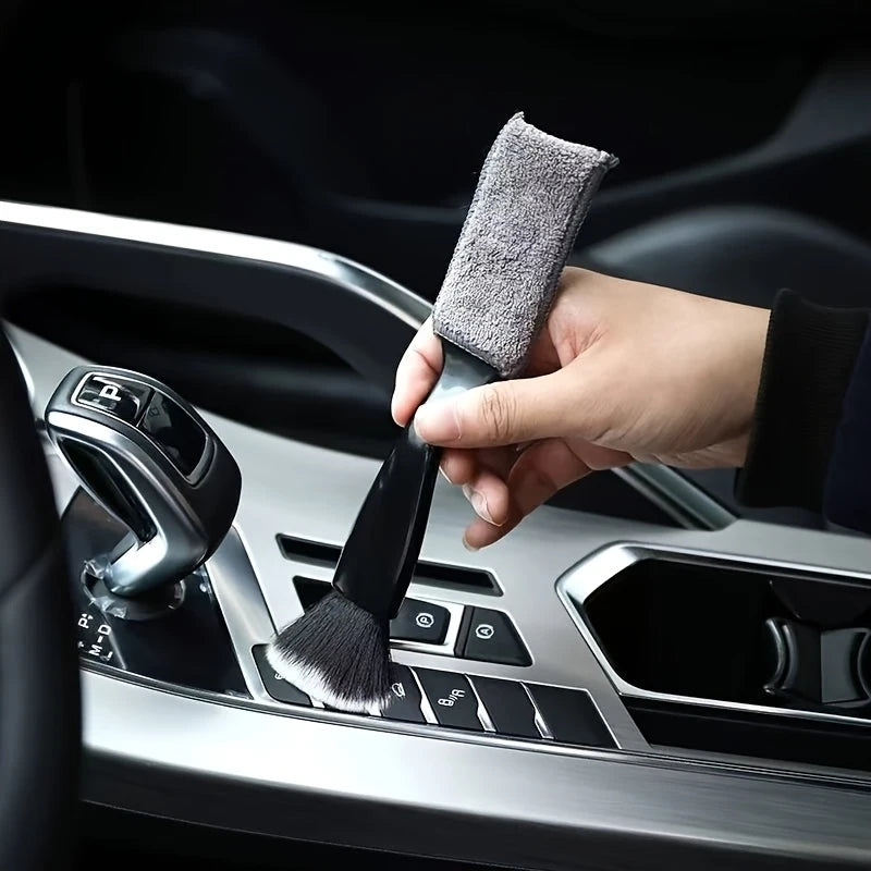 Detailing brush cleaning a car air vent