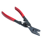 Red trim clip pliers opened at the pivot to show the return spring and jaw | Wrench Haus