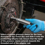 Gloved hand sliding a clutch alignment sleeve and mandrel into a clutch disc, with fitting instructions | Wrench Haus