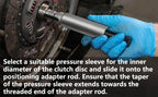 Close-up of clutch alignment mandrel inserted through a clutch disc, with sleeve selection instructions | Wrench Haus