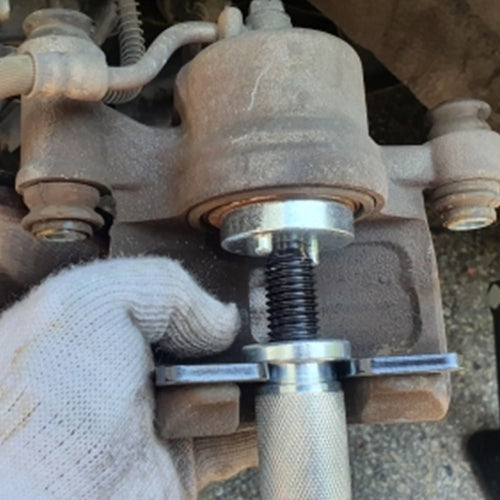 3-Piece Brake Caliper Piston Rewind & Separator Kit - In-use photo showing piston rewind tool installed on brake caliper during pad replacement | Wrench Haus