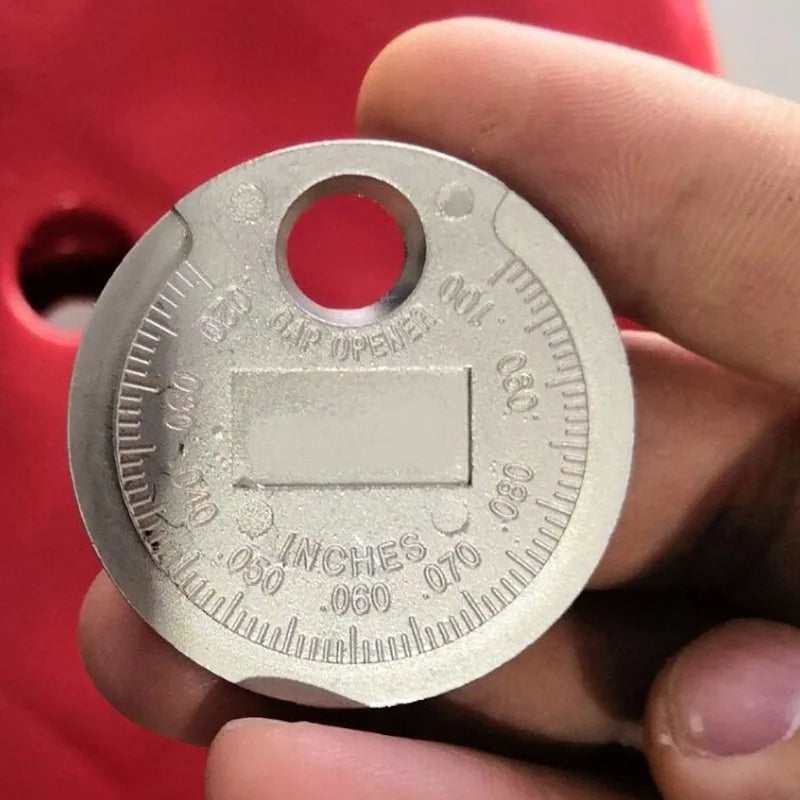 Spark plug gap gauge scale detail close-up