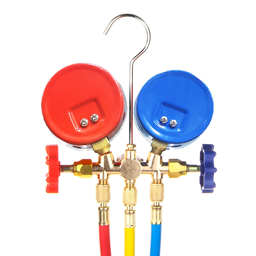 Back of the A/C manifold gauge set showing red and blue gauge housings and valve knobs | Wrench Haus