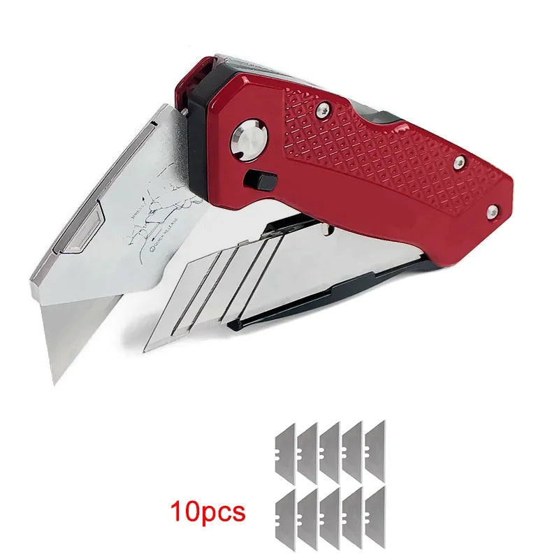 Folding Utility Knife - Red utility knife with 10 replacement trapezoid blades included, laid flat on white background | Wrench Haus