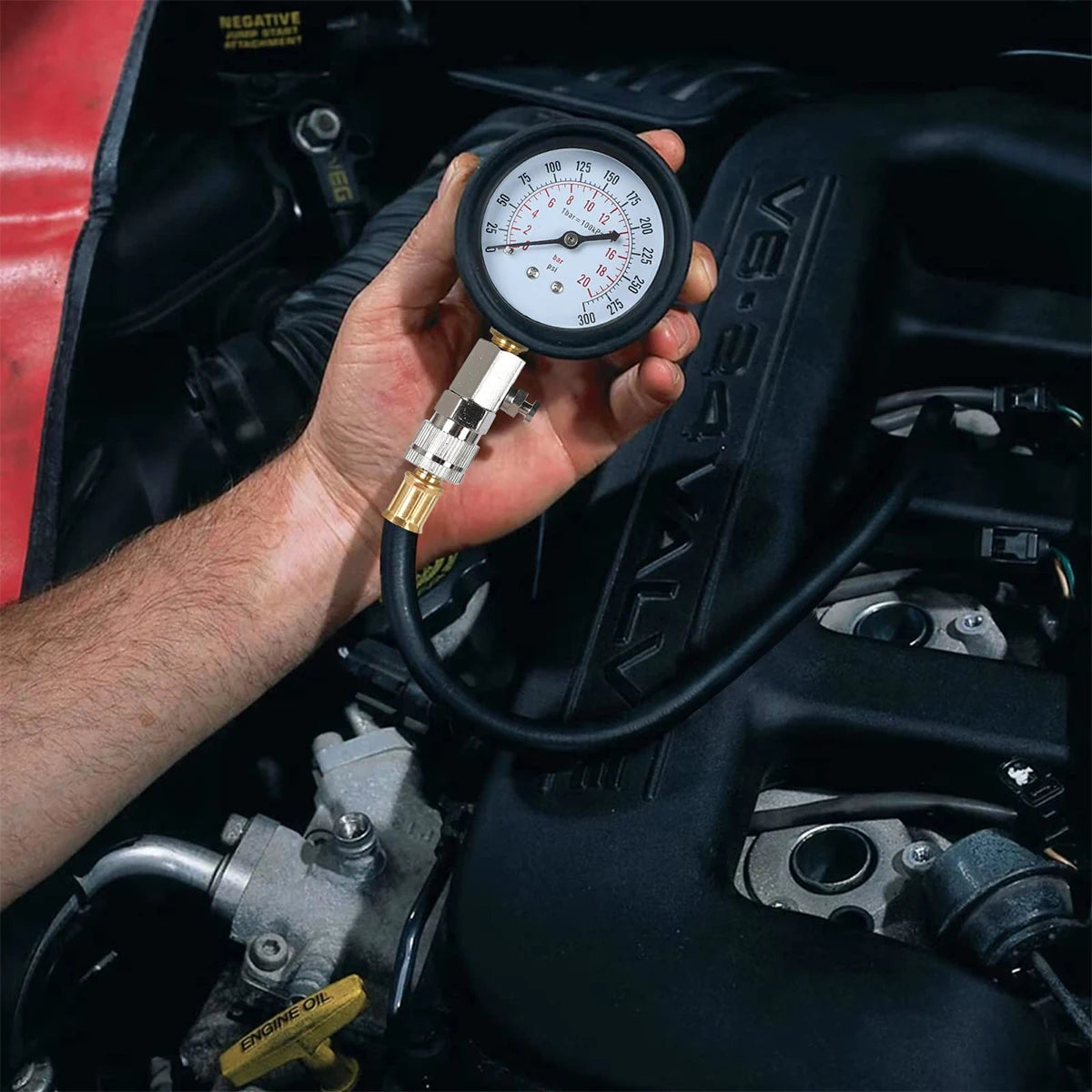 Compression tester in use on engine cylinder