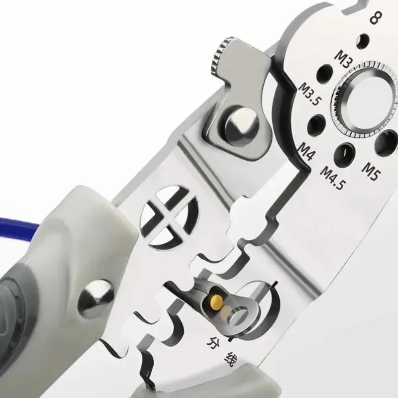 Multifunctional Wire Stripper & Electrician Pliers - Pliers stripping insulation from orange automotive wire showing clean strip action | Wrench Haus