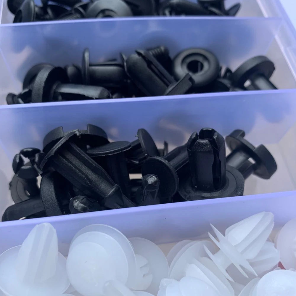 Black push rivets and white fir-tree clips in their case compartments | Wrench Haus