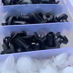 Black push rivets and white fir-tree clips in their case compartments | Wrench Haus