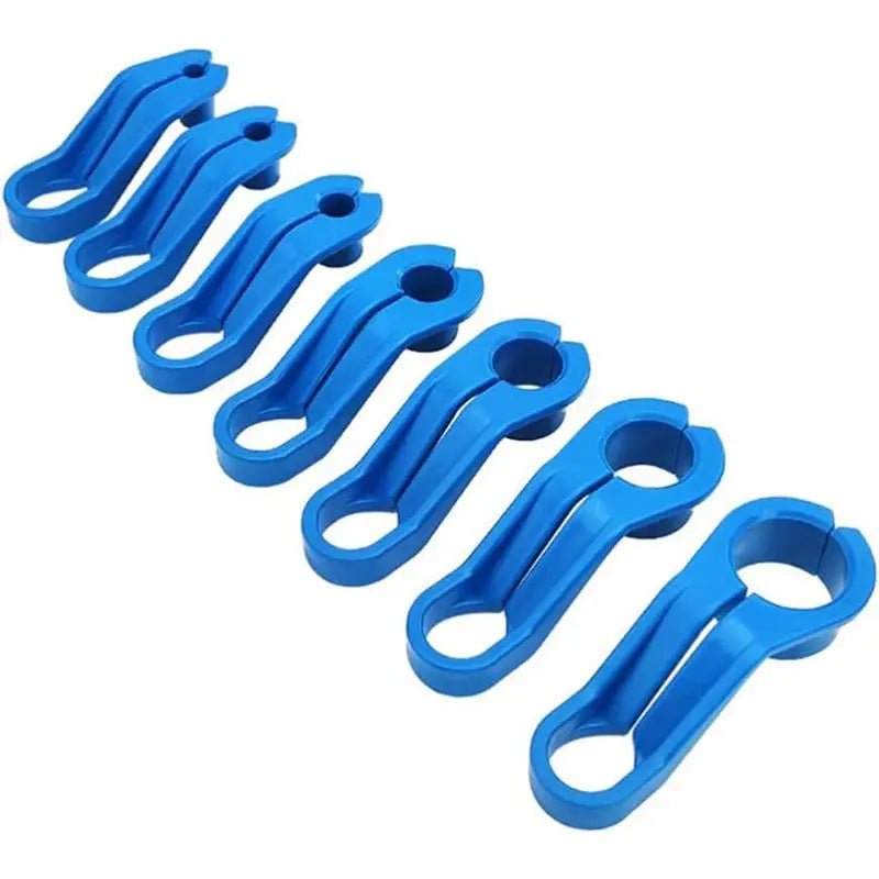 All seven blue A/C and fuel line quick disconnect tools stacked in a row | Wrench Haus