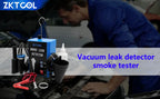EVAP and vacuum smoke leak tester with accessories and a mechanic working in the background | Wrench Haus