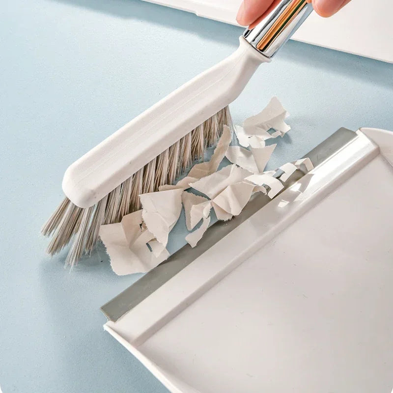 Mini Dustpan & Brush Set - Mini brush sweeping dust and debris into dustpan showing effective cleaning action | Wrench Haus