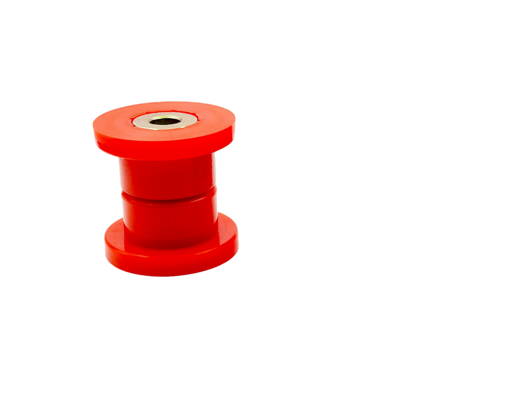 Small red polyurethane control arm bushing with metal sleeve on a black background | Wrench Haus